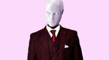man in red and black pinstripe suit jacket
