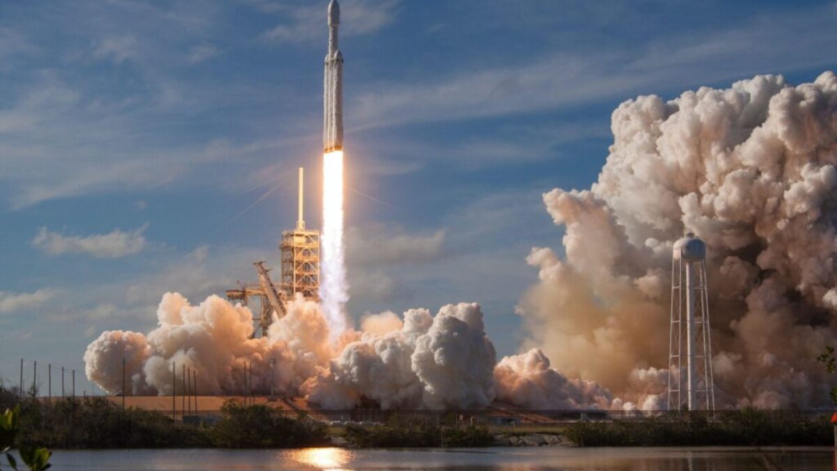 gray spacecraft taking off during daytime
