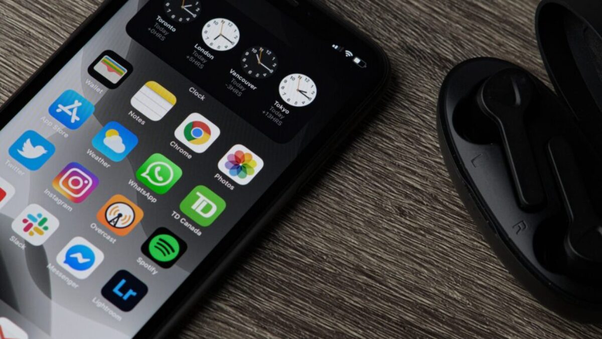 black iphone 5 on brown wooden table