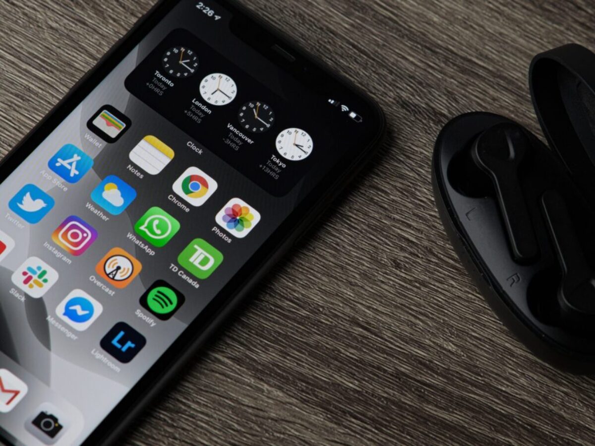 black iphone 5 on brown wooden table
