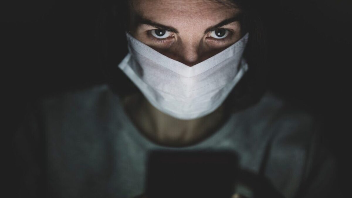 man in white face mask