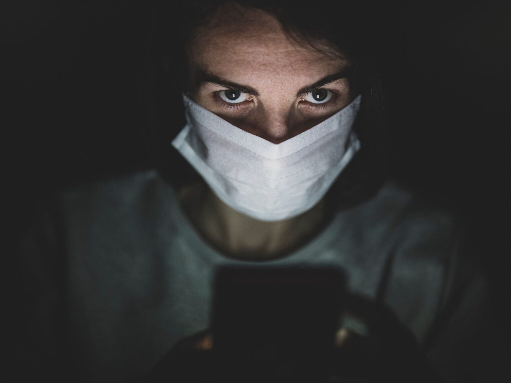 man in white face mask