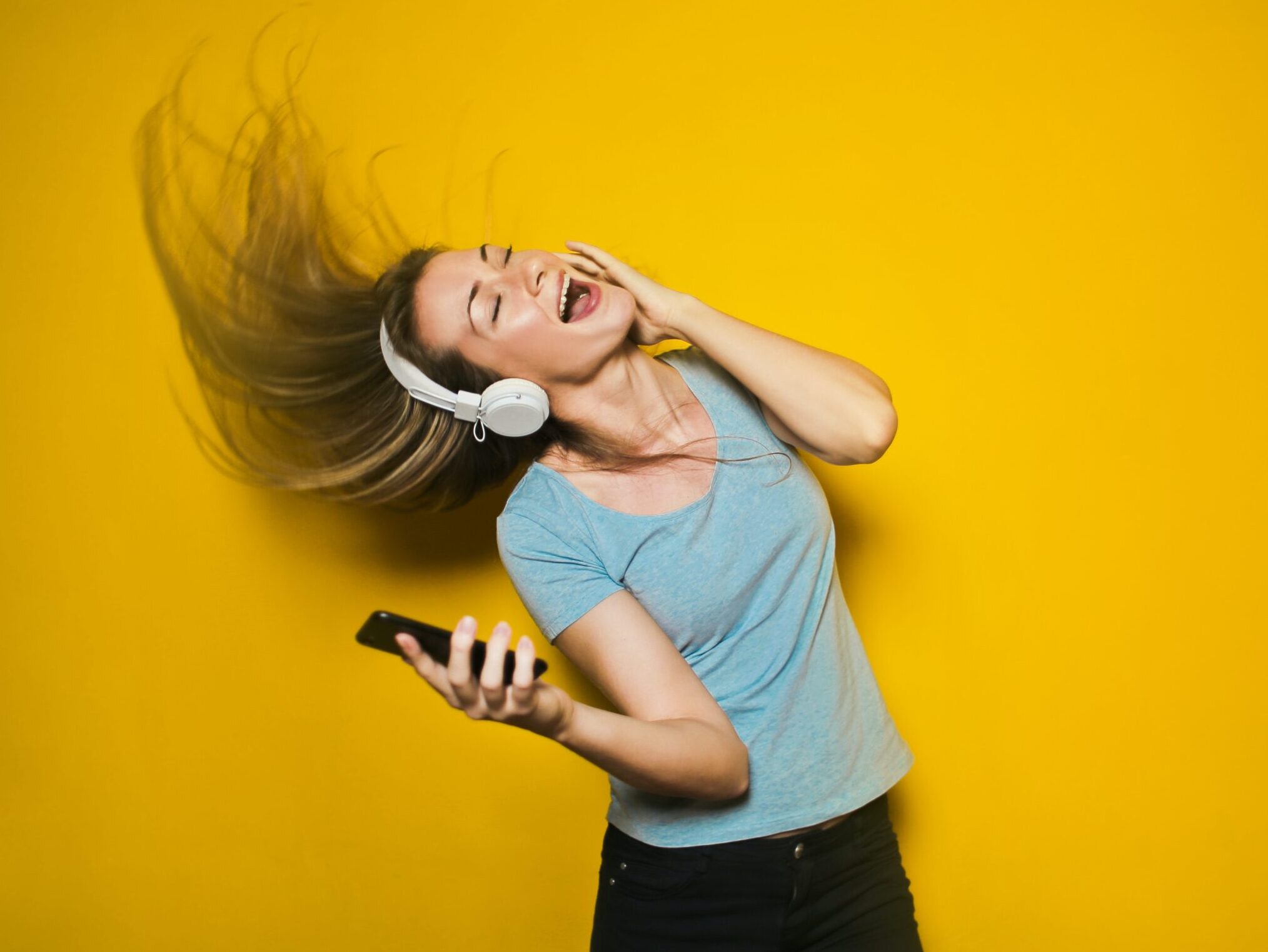 woman wearing white headphones