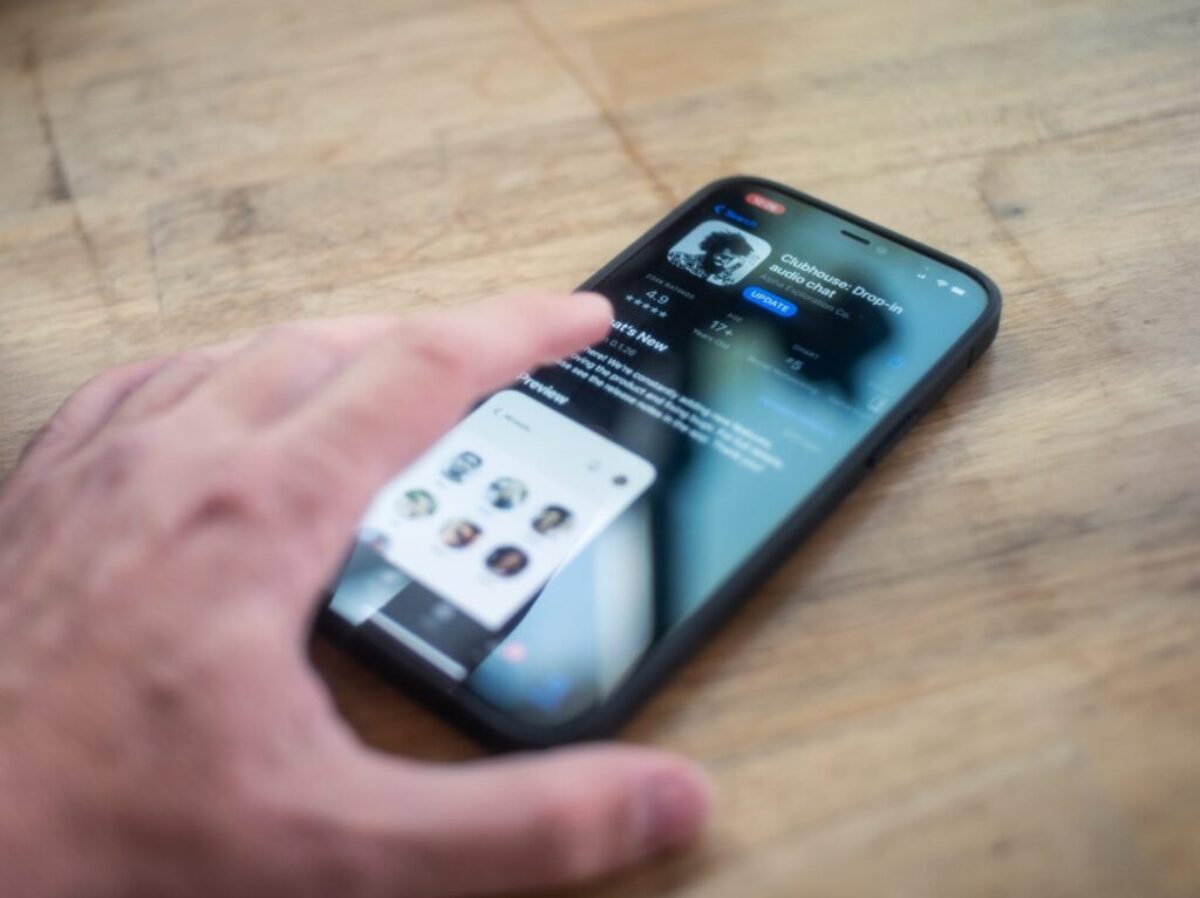 person holding black iphone 4