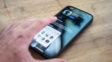 person holding black iphone 4