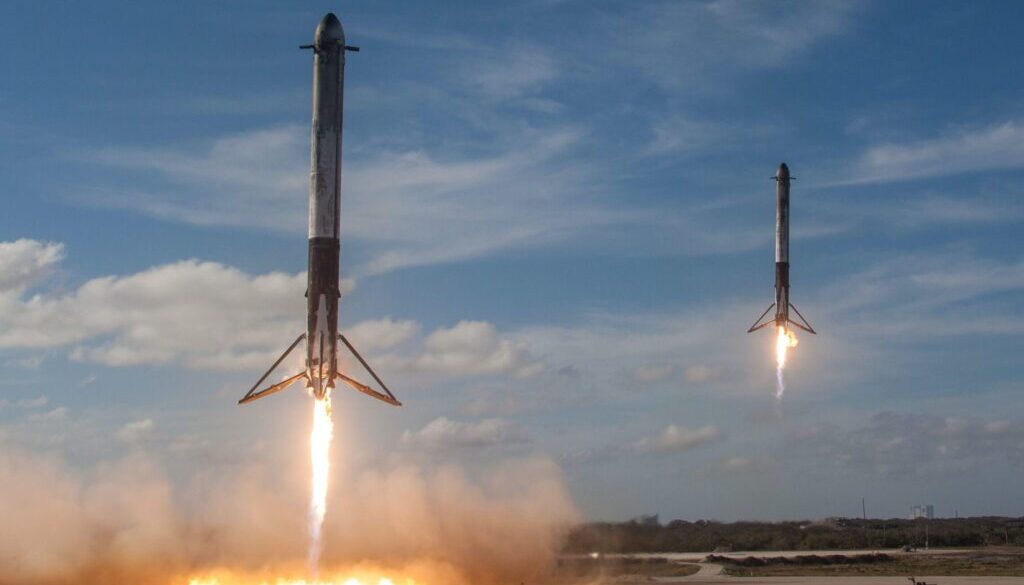 Spacex twom white flying rockets during daytime