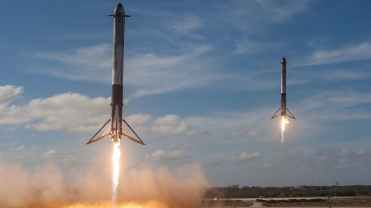 twom white flying rockets during daytime