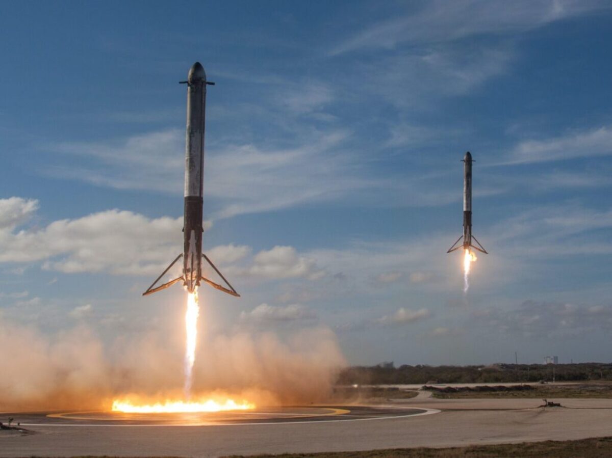 twom white flying rockets during daytime