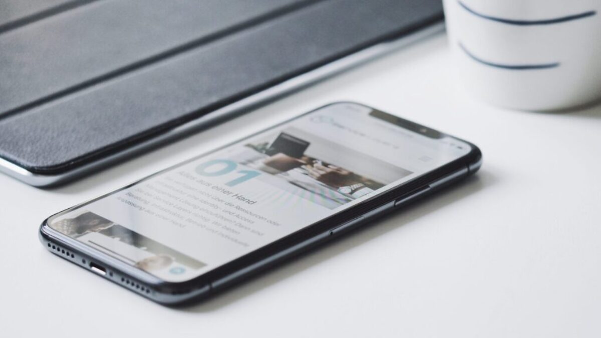 black smartphone beside black smart case