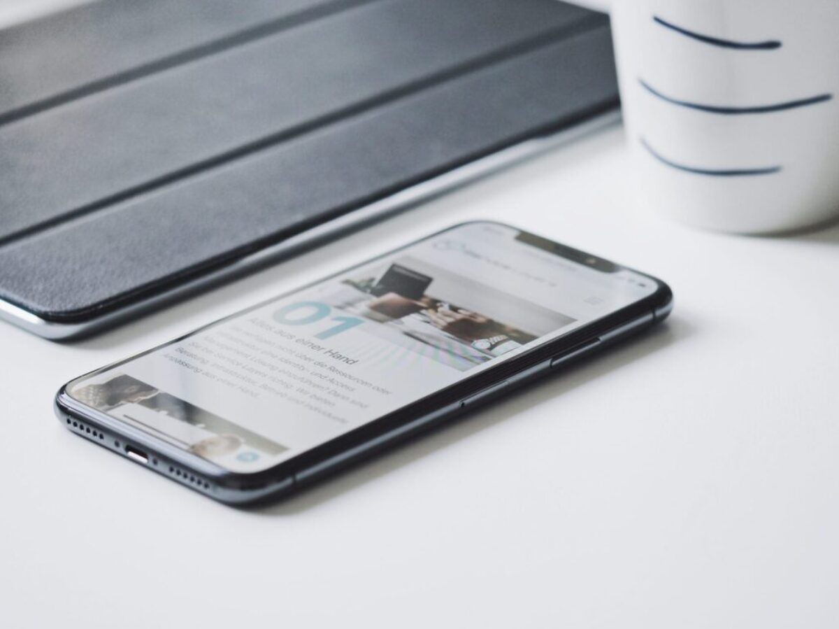 black smartphone beside black smart case