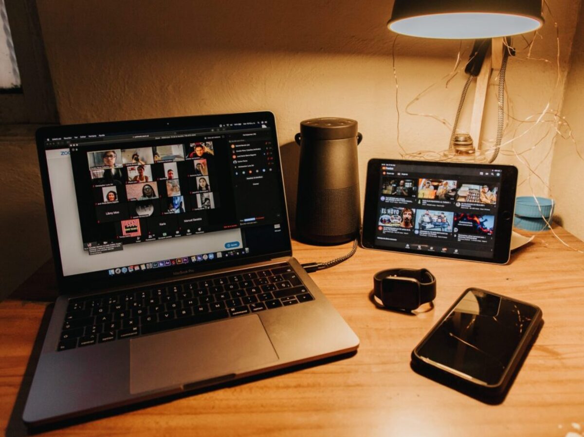 black and silver laptop computer on brown wooden table