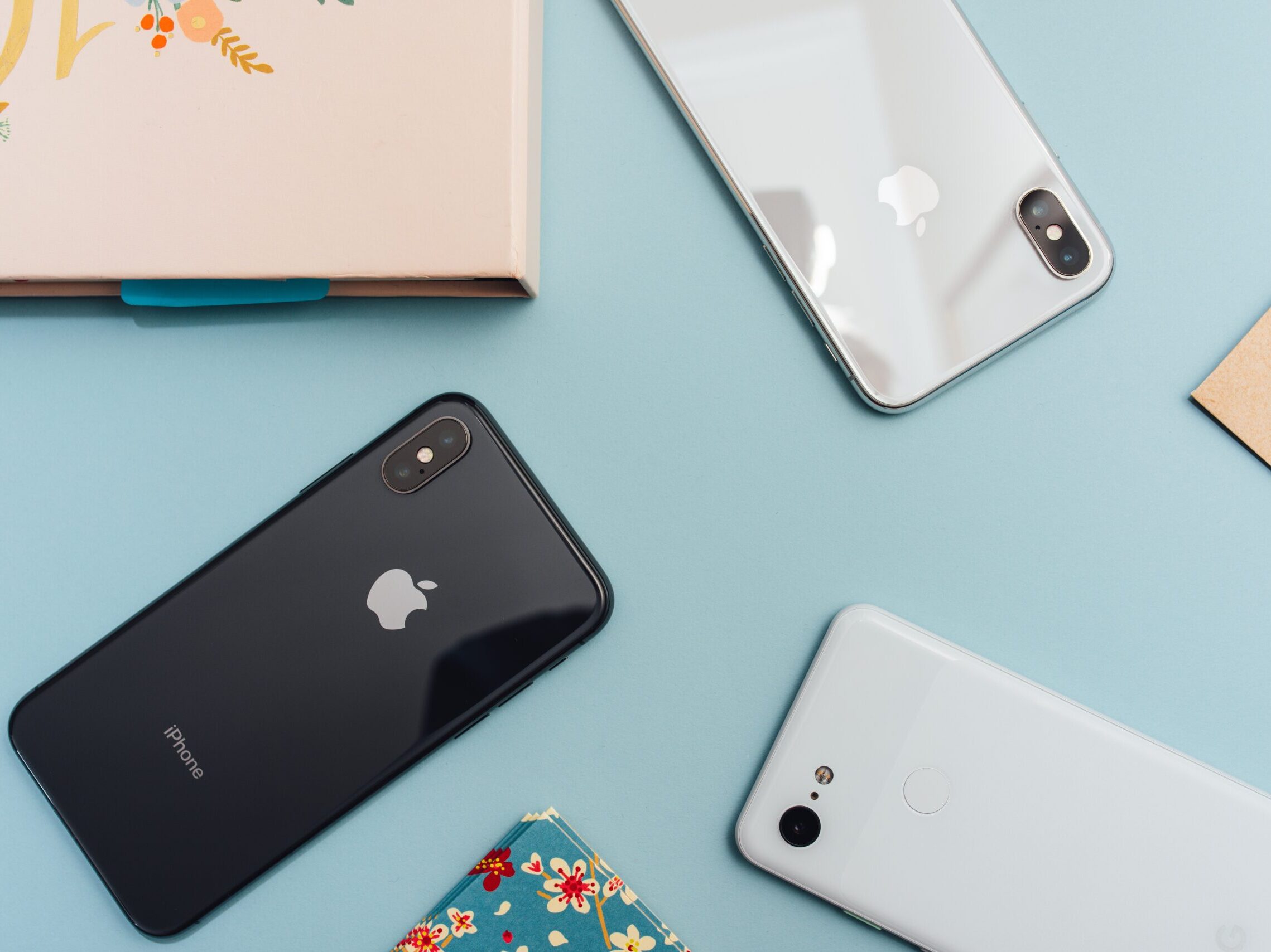 space gray iPhone X on blue surface