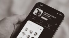person holding black iphone 4