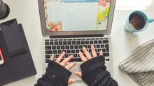person in black long sleeve shirt using macbook pro