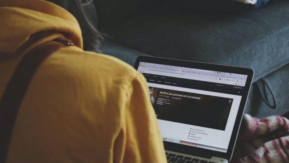 macbook pro on persons lap