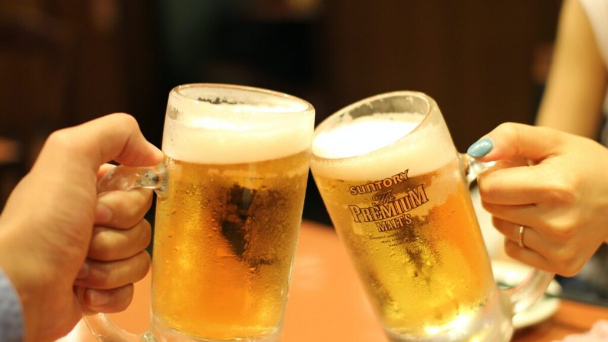 two mugs of brown liquids