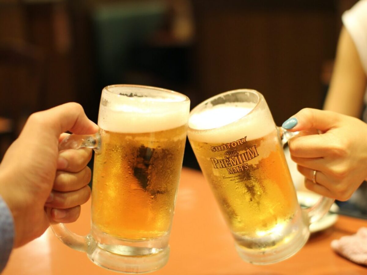 two mugs of brown liquids