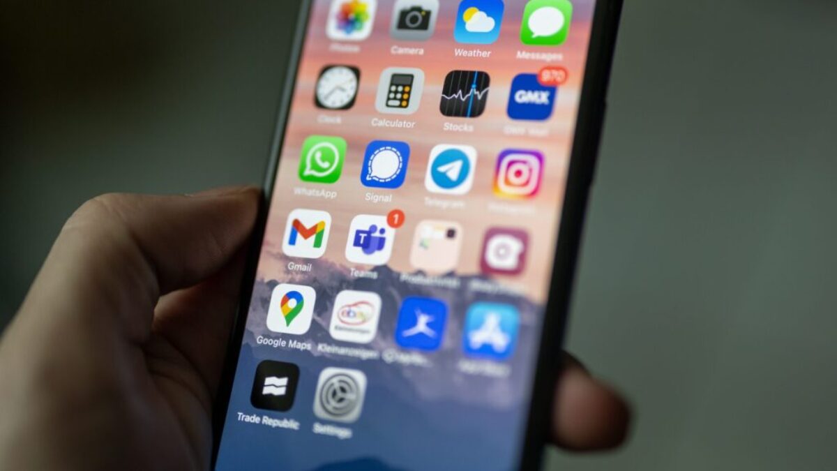 person holding black iphone 4