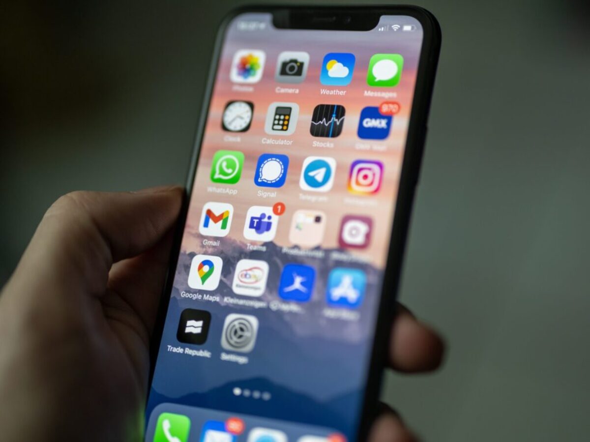 person holding black iphone 4