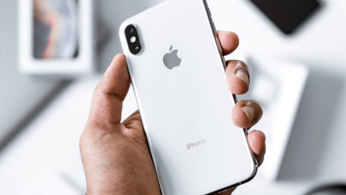 person holding silver iPhone X
