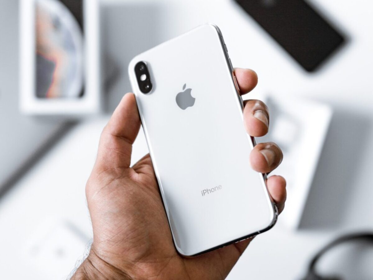 person holding silver iPhone X
