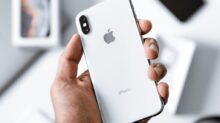person holding silver iPhone X