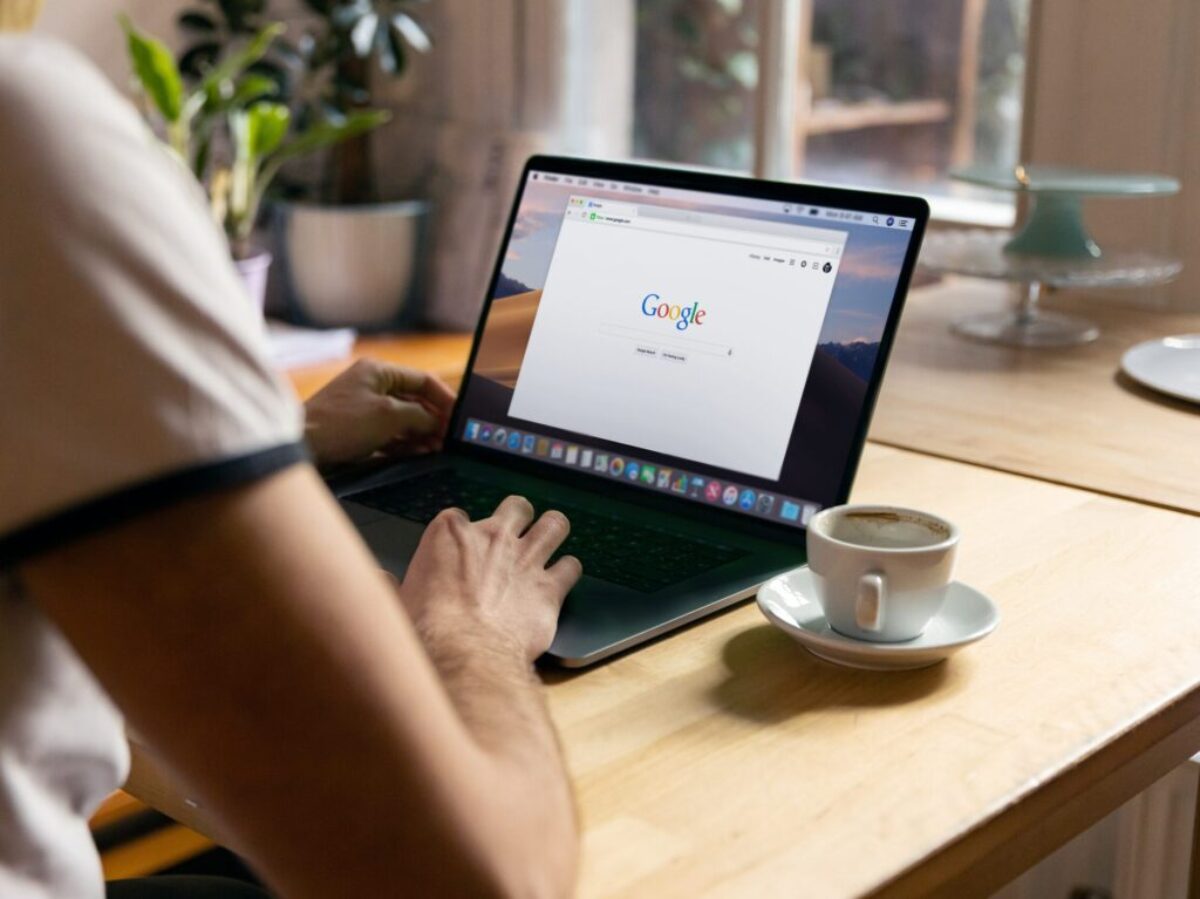 person using black laptop computer