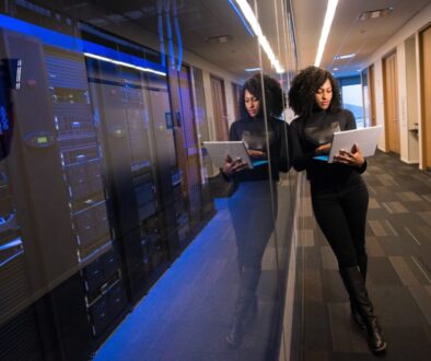 woman in black top using MacBook