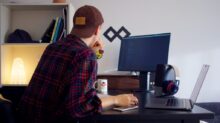 man in front of desktop