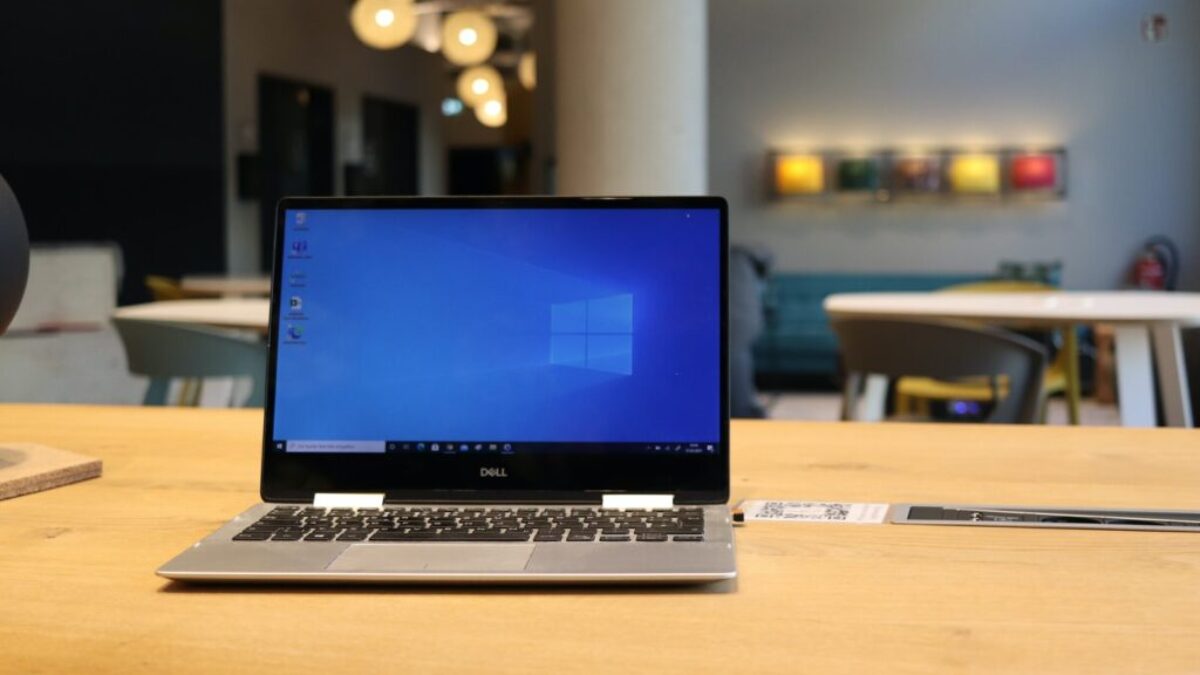 macbook pro on brown wooden table