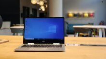 macbook pro on brown wooden table