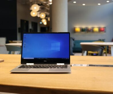 macbook pro on brown wooden table