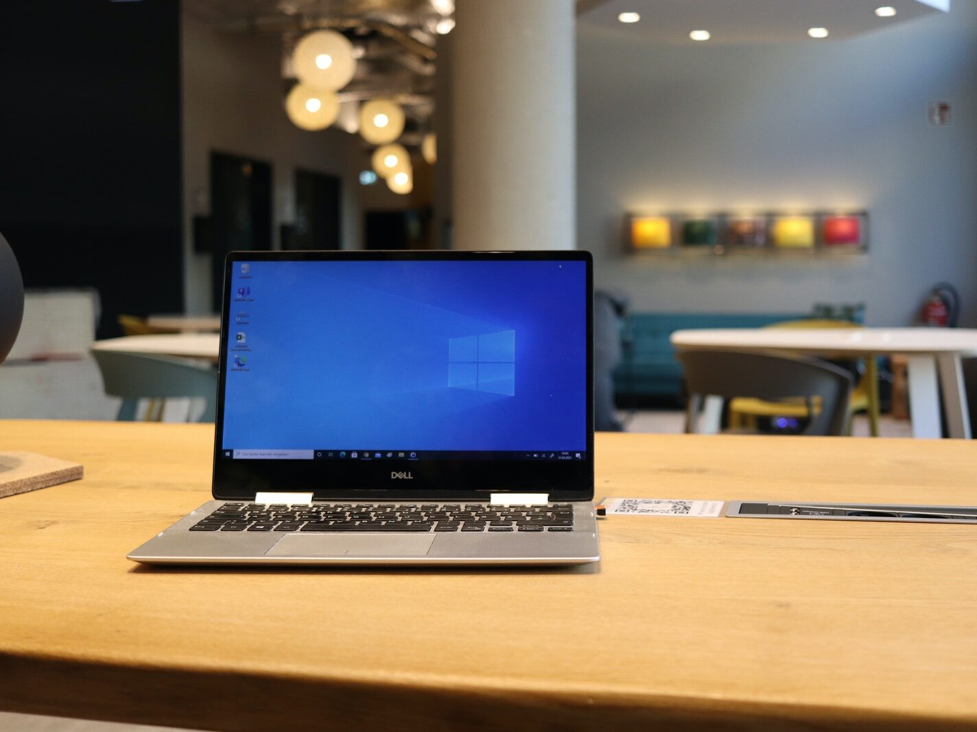 macbook pro on brown wooden table