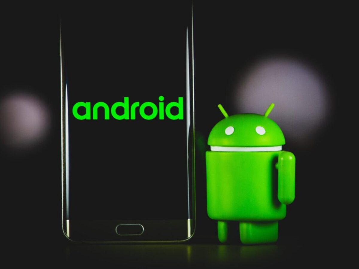 green frog iphone case beside black samsung android smartphone