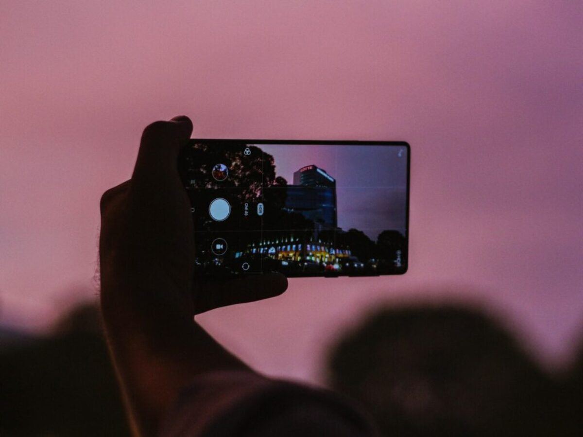person holding black android smartphone