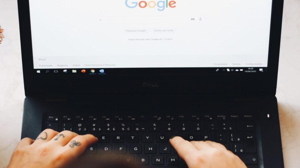 person using black laptop computer