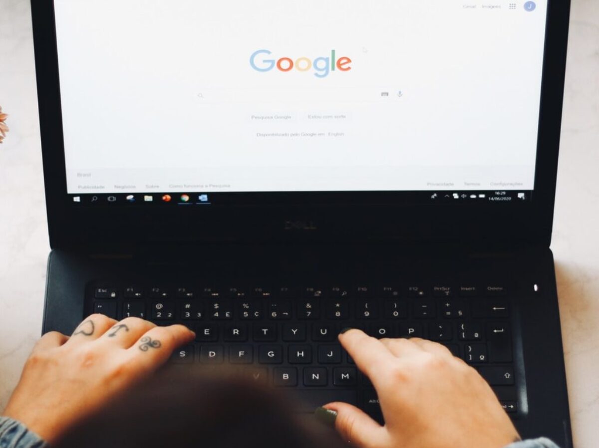 person using black laptop computer