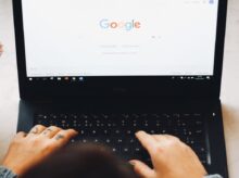 person using black laptop computer