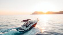 man riding on white and red boat on sea during daytime