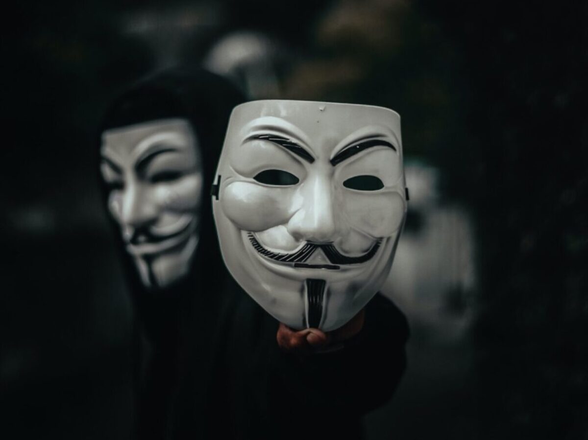 person in black and white mask