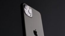 silver iphone 5s on black surface