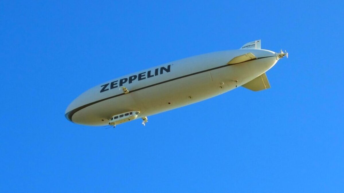white and black plane in the sky during daytime