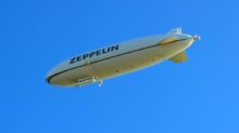 white and black plane in the sky during daytime