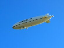white and black plane in the sky during daytime