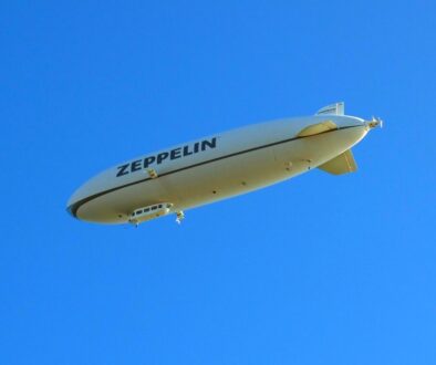 white and black plane in the sky during daytime