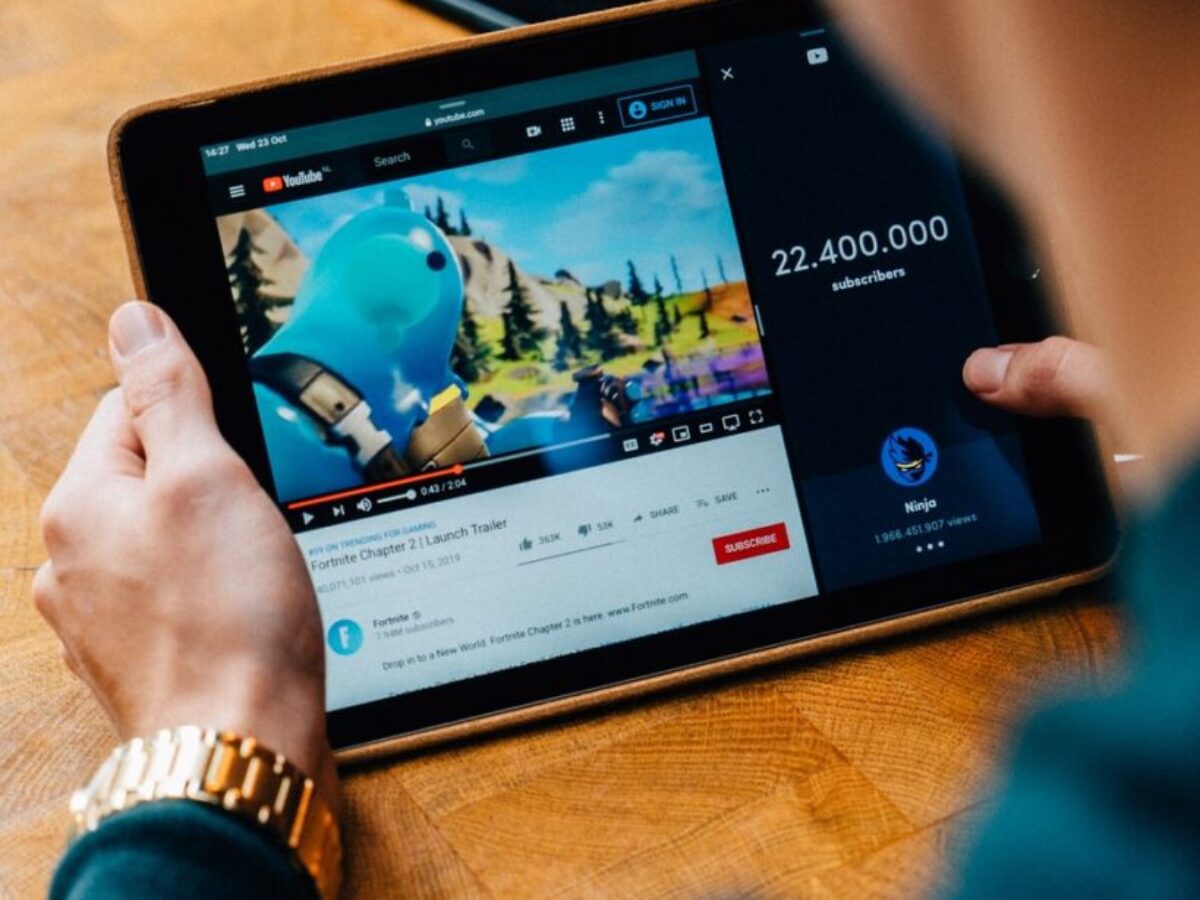 selective focus photography of person using tablet computer
