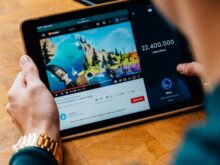 selective focus photography of person using tablet computer