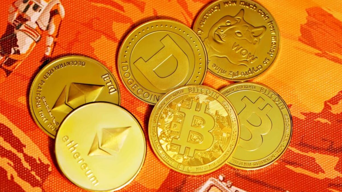 gold round coins on red textile