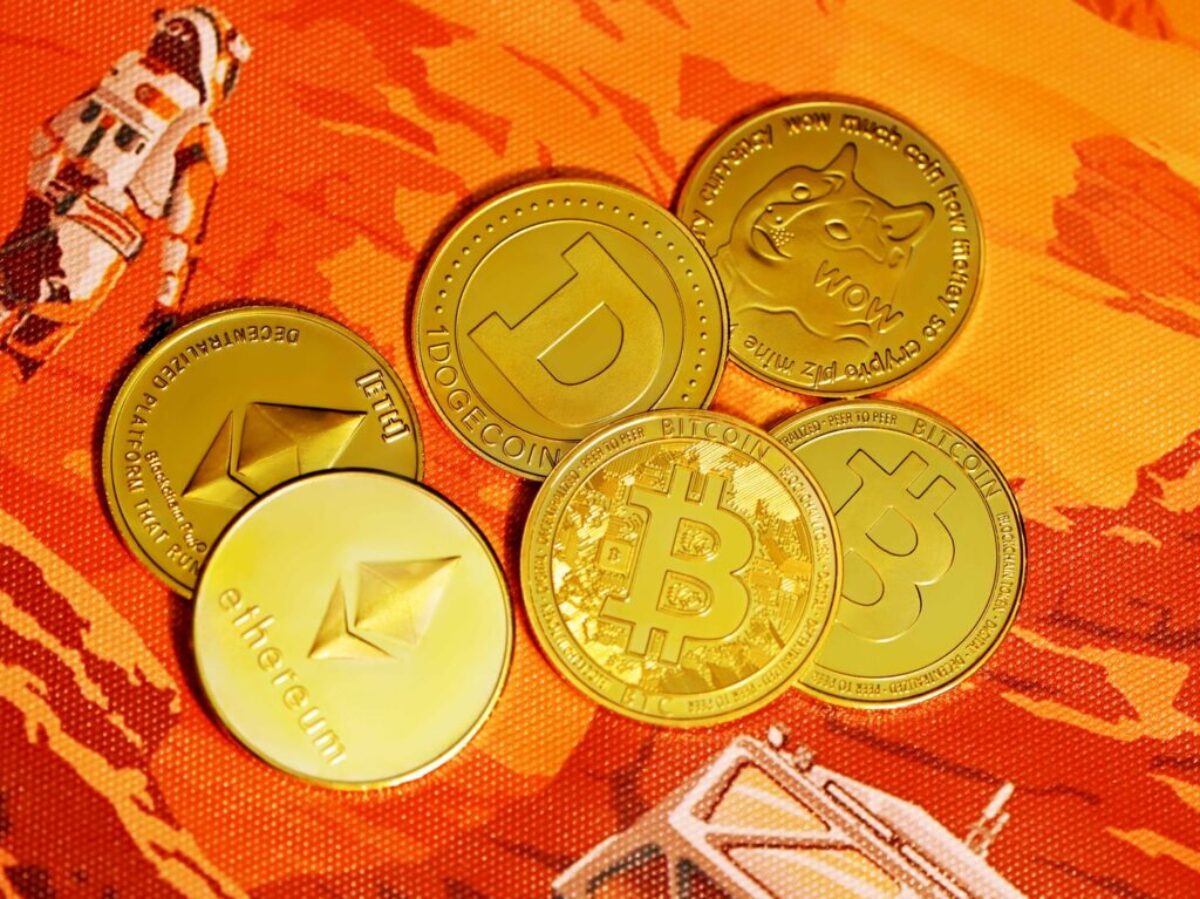 gold round coins on red textile