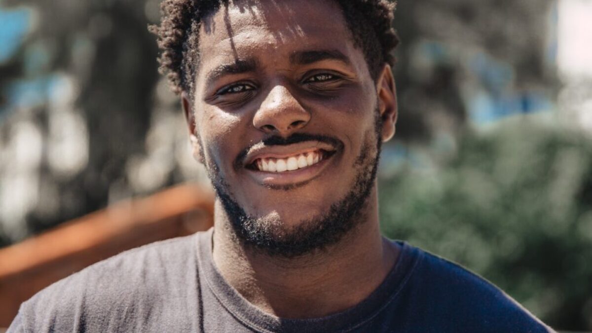 selective focus of man smiling during daytime